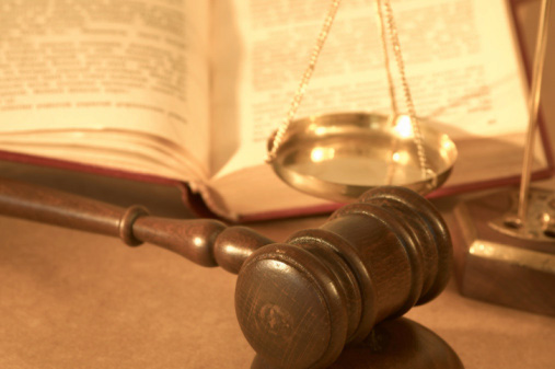 Gavel, scale, and book