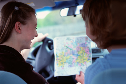 Women in Car Looking at a Map