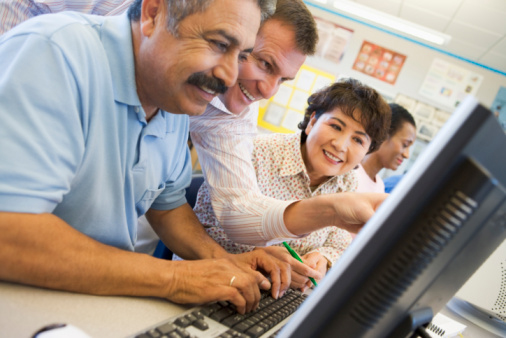 Adults in Classroom on the Computer