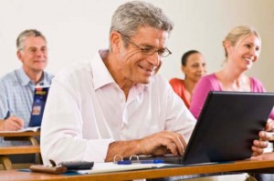 Adult Learning on Laptop in Classroom