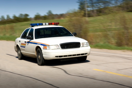Police Car Traveling on the Road