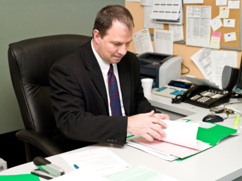 Car Salesman in his Office