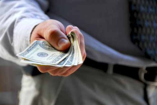 Man Handing Over Cash