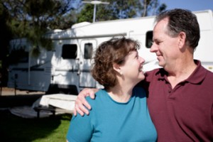 Couple Standing in Front of RV