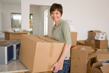 Woman Packing Moving Boxes