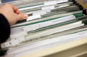 Hand and Files in FIle Cabinet