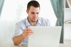 Man Researching on Laptop