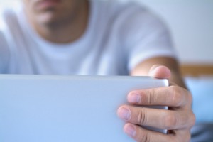 Man Opening a Laptop