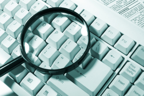 Magnifying glass on computer keyboard