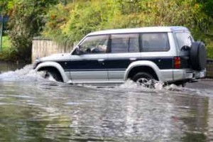 Car Driving Through A Flood