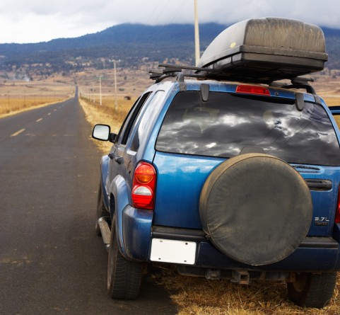 Blue Jeep on the side of the road
